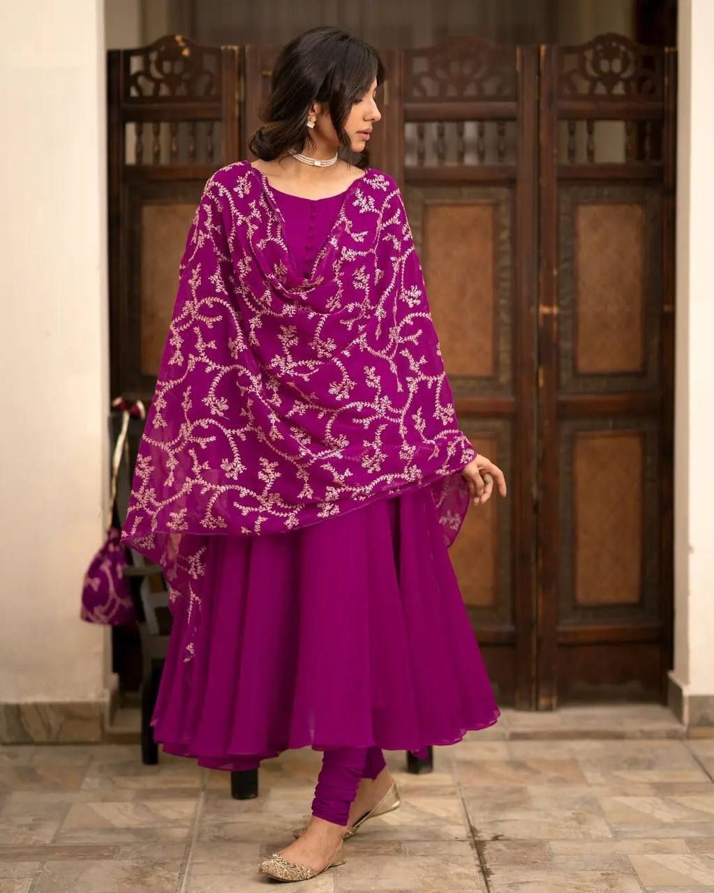 TRADITIONAL ANARKALI PAIRED WITH A EMBROIDERED DUPATTA AND A POTLI BAG