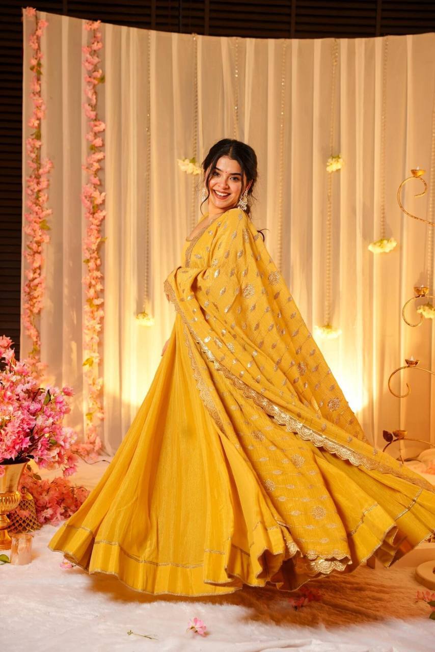 YELLOW FLARED GOWN FOR WOMEN WITH EMBROIDERED DUPATTA & BUNCH OF LATKANS
