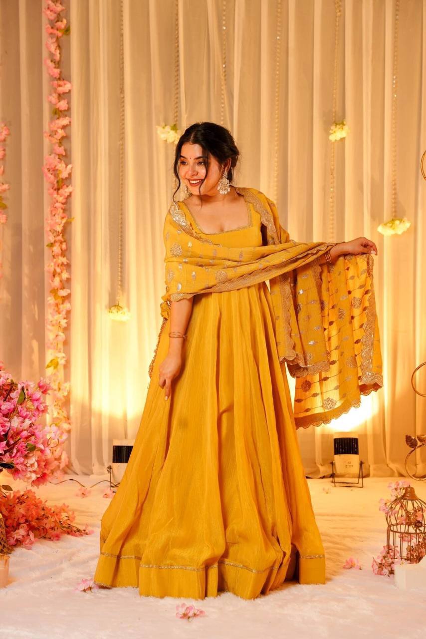 YELLOW FLARED GOWN FOR WOMEN WITH EMBROIDERED DUPATTA & BUNCH OF LATKANS