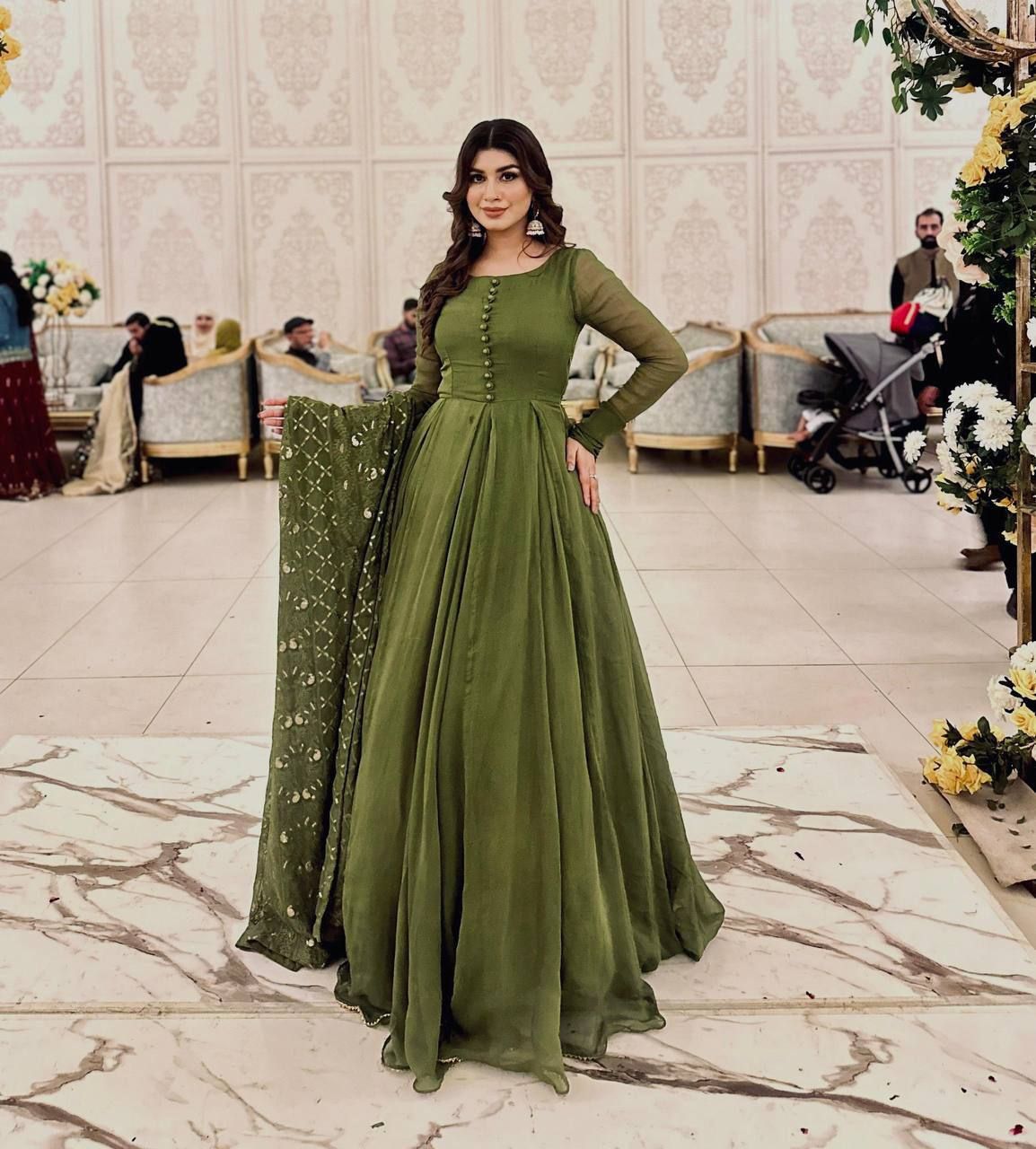 A STUNNING GREEN GEORGETTE SUIT WITH A EMBROIDERED DUPATTA