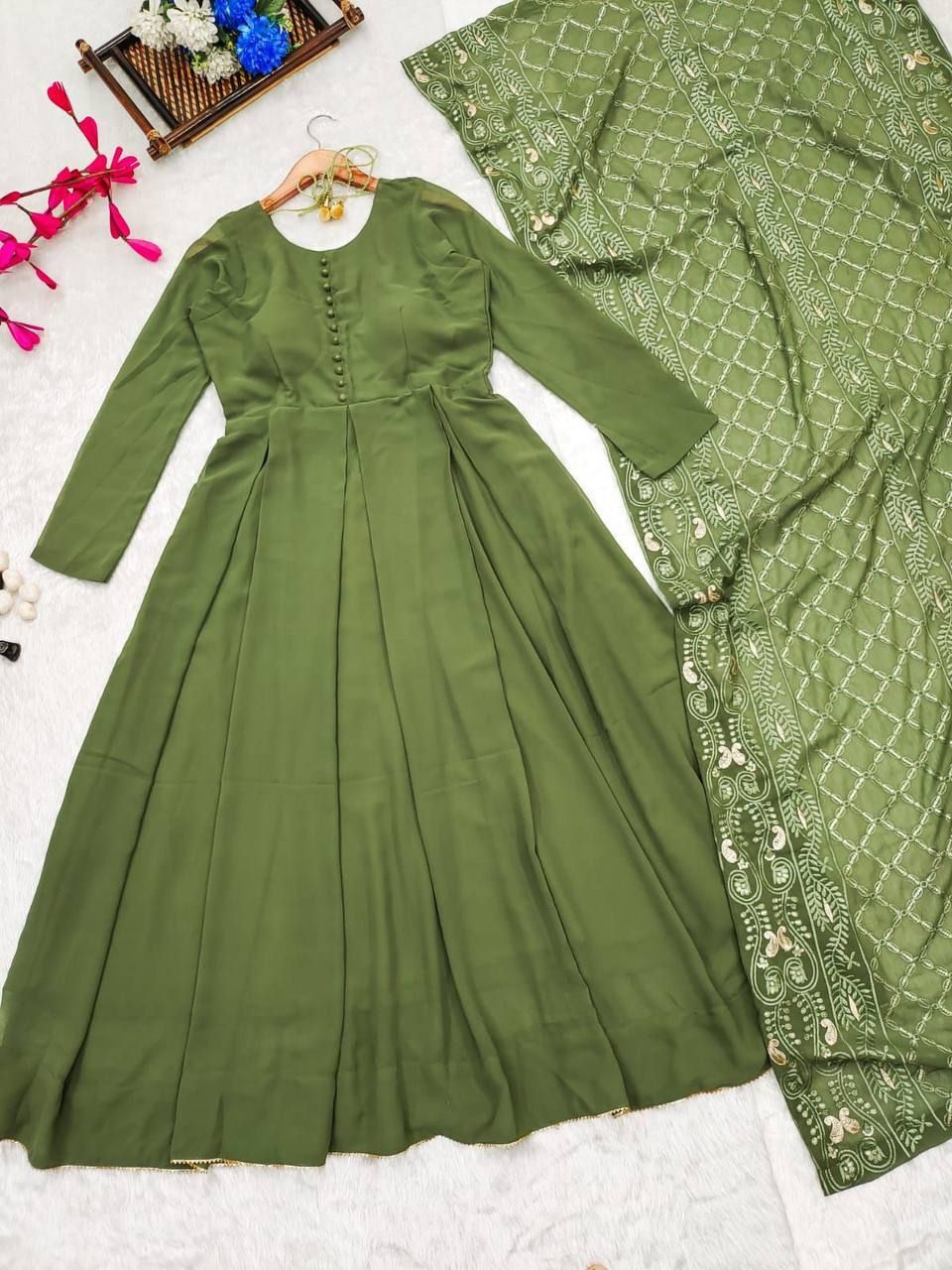 A STUNNING GREEN GEORGETTE SUIT WITH A EMBROIDERED DUPATTA