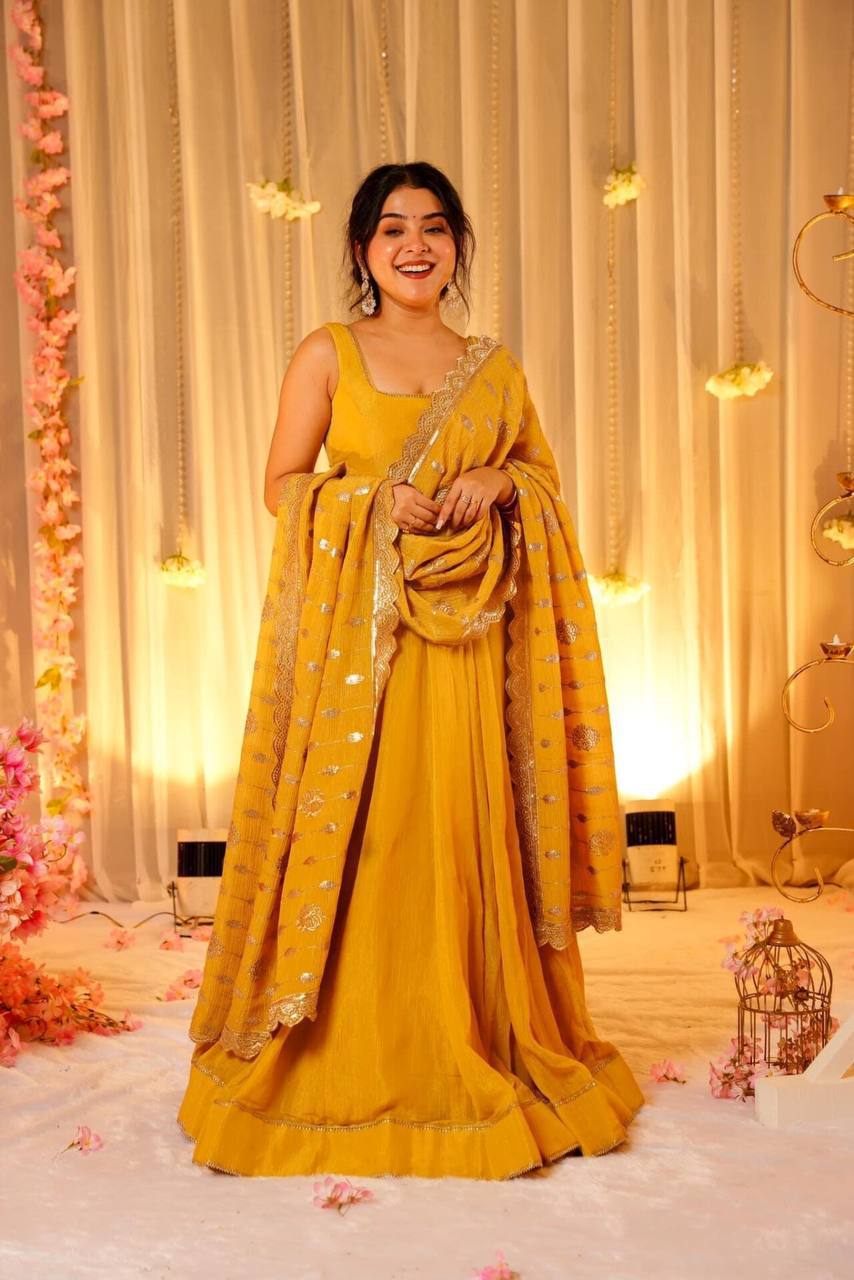 YELLOW FLARED GOWN FOR WOMEN WITH EMBROIDERED DUPATTA & BUNCH OF LATKANS